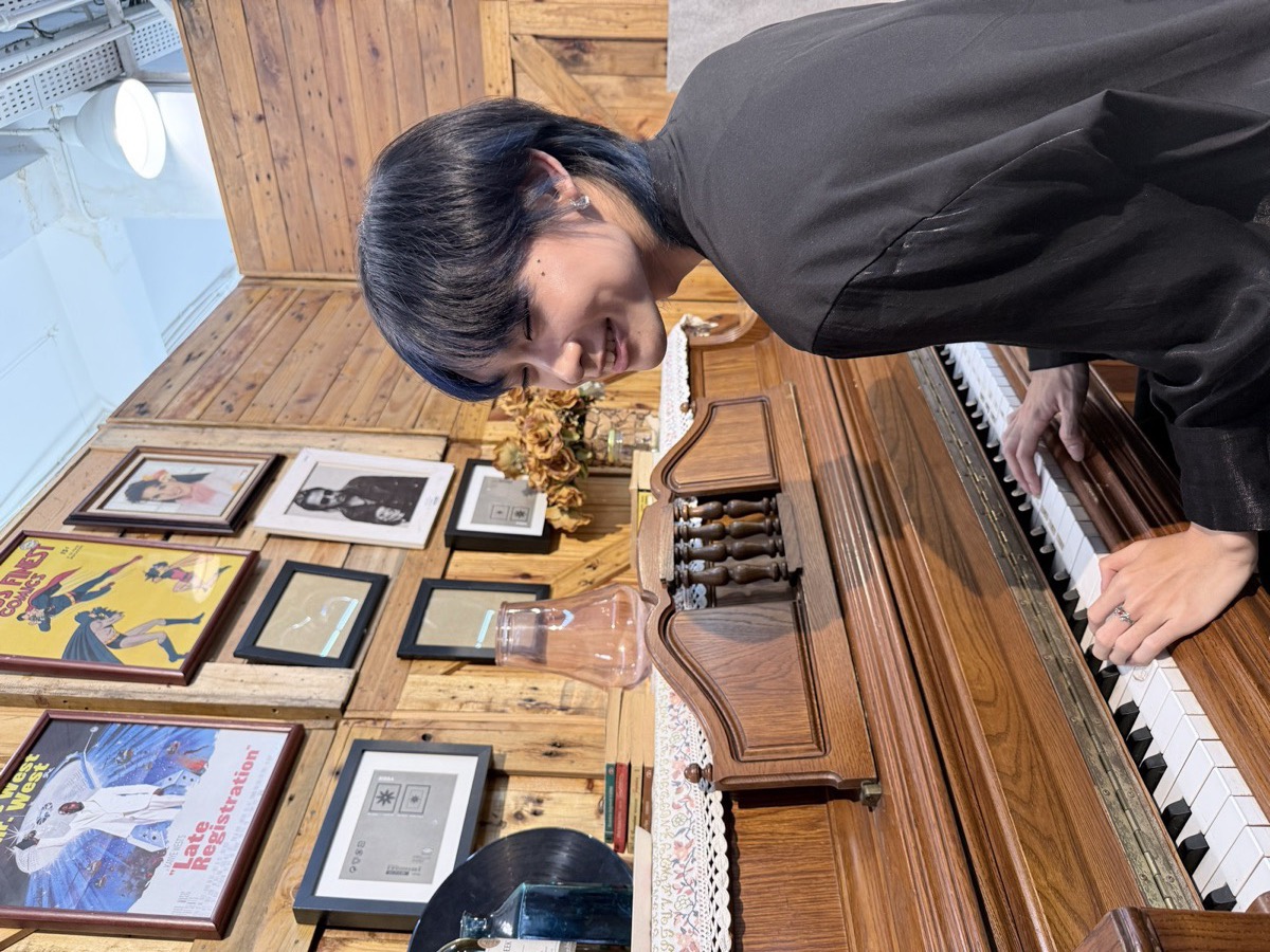 At an old upright piano