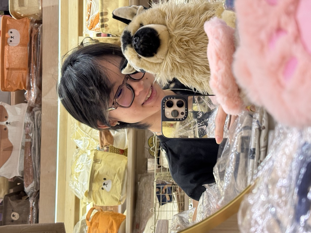 Mirror selfie in a plushie shop